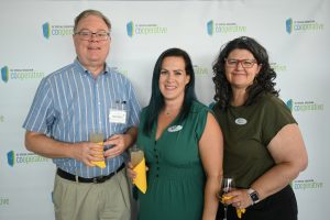 A volunteer from Compass Pro Bono and two Co-op staff members